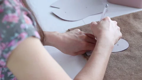 Women's hands create a textile product, toy, pattern Video stock 88245742