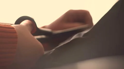 Women's hands cut black thread 4K Stock Footage 102470651