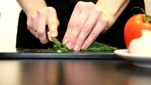 Women's hands cut dill Video stock 98575664