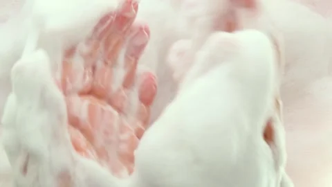 Women's hands in foam do a smooth massage of the hands, palm, fingers. Part 7 Stock Footage 282549495