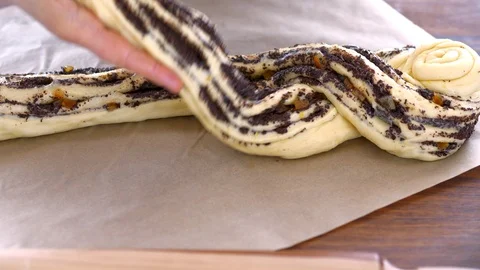 Women's hands form a braid of dough Stock Footage 88702360