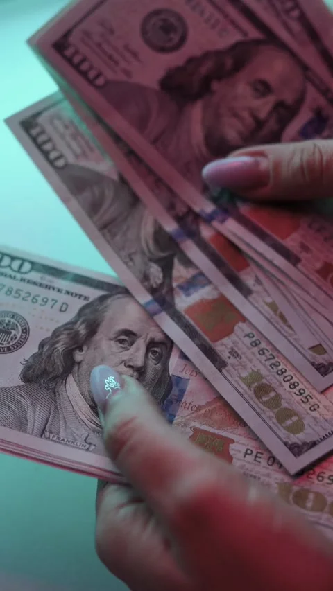 Women's hands hold, count, leaf through dollars in their hands, close-up Stock Footage 250124646