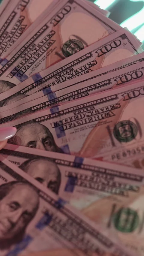 Women's hands hold, count, leaf through dollars in their hands, close-up Stock Footage 250125096