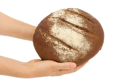 Women's hands holding loaf of bread, isolated on white background Stock Photos