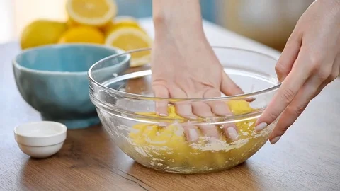 Women's hands knead the dough in the bowl Stock Footage