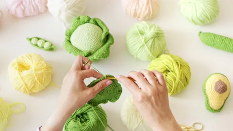Women's hands knitting with crochet hook and woolen threads Stock Footage 211734147