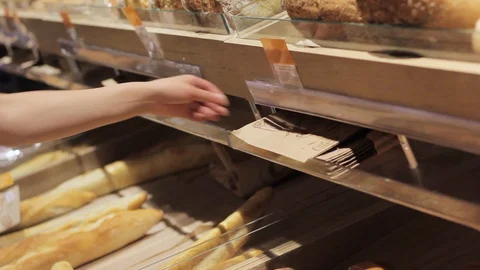 Women's hands lay a loaf of bread in a box Stock Footage 91684296