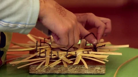 Women's Hands Make Sun Decor from Pieces of Withered Reeds Stock Footage 257973264