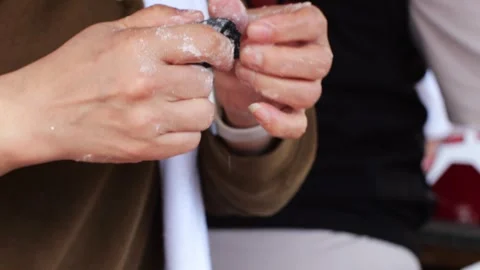 Women's hands making Asian Chinese dumplings with meat or vegetable filling Stock Footage 303491553