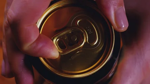 Women's hands opens a can of beer, close-up Stock Footage 103461568