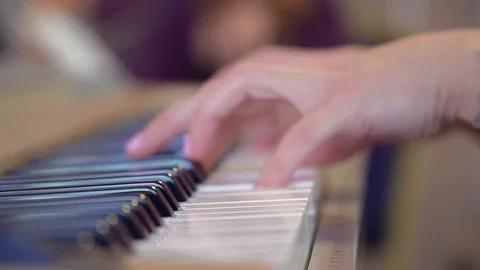 Women's hands played on the keys Stock Footage 98222384