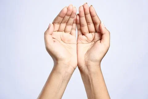 Women's hands in prayer Stock Photos