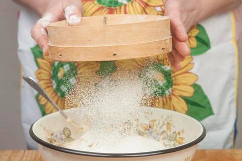 Women's hands preparing flour before baking pie Stock Photos