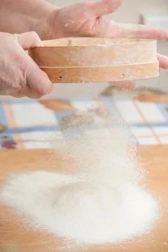 Women's hands preparing flour before baking pie Stock Photos