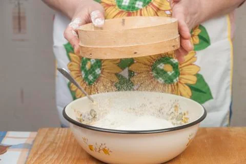 Women's hands preparing flour before baking pie Stock Photos