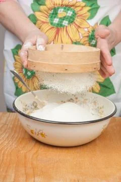 Women's hands preparing flour before baking pie Stock Photos