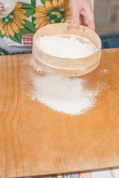 Women's hands preparing flour before baking pie Stock Photos