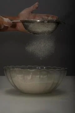 Women's hands preparing flour for baking bread Foto stock