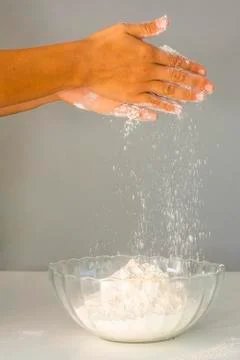 Women's hands preparing flour for baking bread Stock Photos