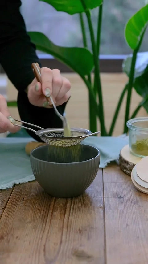 Women's hands preparing matcha tea. Vertical video Stock Footage 240186897