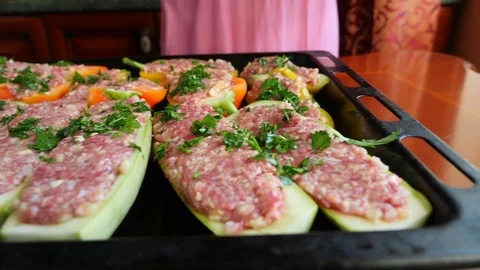 Women's hands preparing zucchini stuffed with minced meat and Bulgarian peppers Stock Footage 81105103