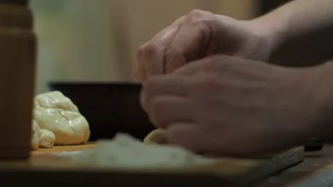 Women's hands put and wrap the filling in yeast dough. cooking pies at home Stock Footage 147740022