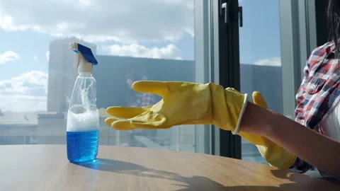 Women's hands put on rubber gloves against the background of a beautiful Stock Footage 160500744