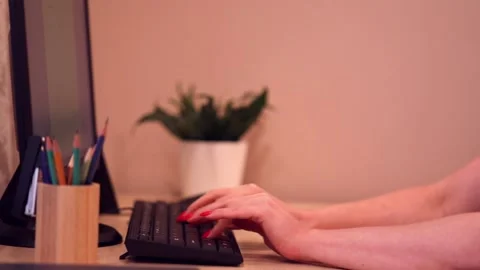 Women's hands quickly type on the keyboard. The concept of office or remote work Stock Footage 147602717