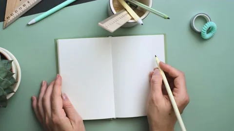 Women's hands ready to write in the empty notebook Stock-Footage 157041827