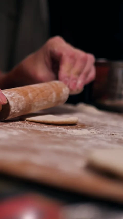 Women's hands rolling out dough. vertical screen Stock Footage 287951287