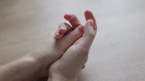 Women's hands rub against each other from overexpression Stock Footage 266898408