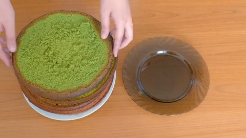 Women's hands shift multi-colored sponge cakes Stock-Footage 109373758