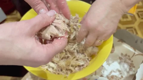 Women's hands sort out boiled poultry meat while preparing a traditional me.. Stock Footage 238851354