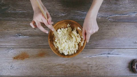 Women's hands stirred curd Video stock 72990531