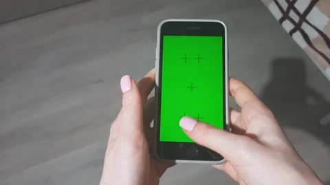 Women's hands swipe on the screen of the smartphone. Chroma key. FullHD Stock Footage 195173636
