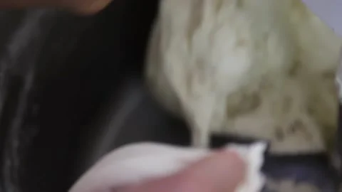 Women's hands take the dough Stock Footage 146574224