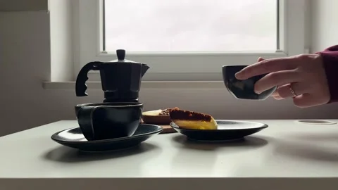 Women's hands taking a cup of coffee on the table Geyser coffee maker. Coffee Stock Footage 238944246
