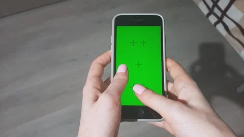 Women's hands tap on the screen of the smartphone. Chroma key. FullHD Stock Footage 194534608