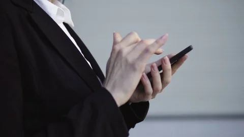 Women's hands touch smart phone screen Stock Footage 77626133