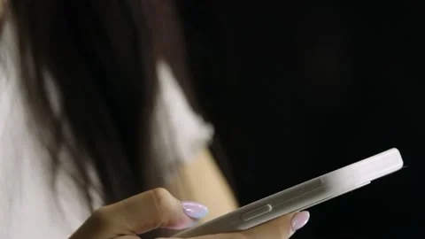 Women's hands type in phone, macro close-up, text on touch screen, hands with Stock Footage 221641060