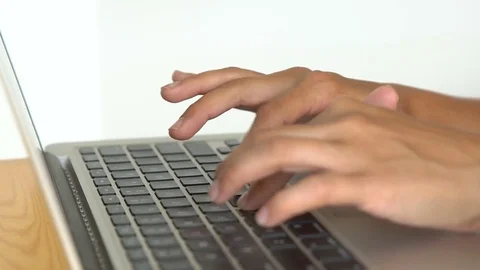 Women's hands typing on computer keyboard Stock Footage 77565144