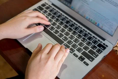 Women's hands typing on computer Stock Photos