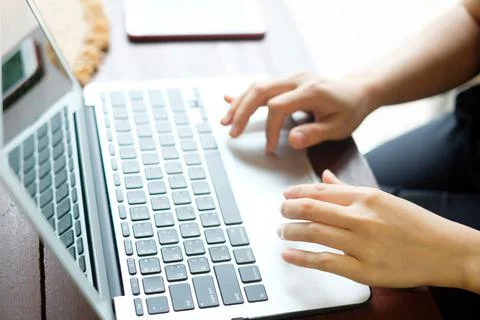 Women's hands typing on computer Stock Photos