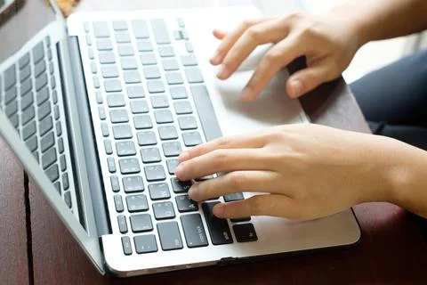 Women's hands typing on computer Stock Photos
