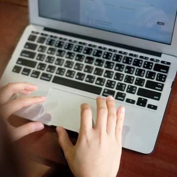 Women's hands typing on computer Stock Photos