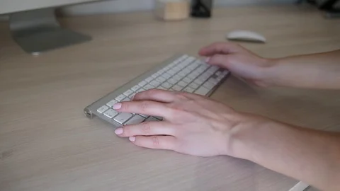 Women's hands typing on computer with white keyboard close up Stock Footage 98094376
