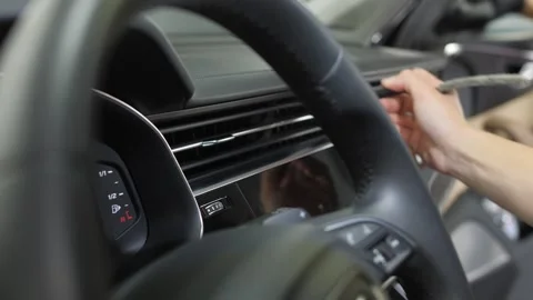 Women's hands use a cleaning brush and remove dust from the ventilation. Video stock 247316368