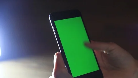 Women's hands use the phone with hroma key. Stock Footage 96985553