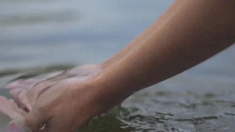 Women's hands in water Stock Footage 93825425