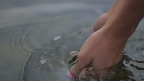 Women's hands in water Stock Footage 94886376